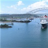Cunard’s Queen Mary passes under the Bridge of Americas after passing through the Panama Canal