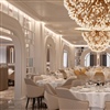 Oceania Allura’s Grand Dining room features hydrangea chandeliers, inspired by great European conservatories (Photo: Douglas Friedman)
