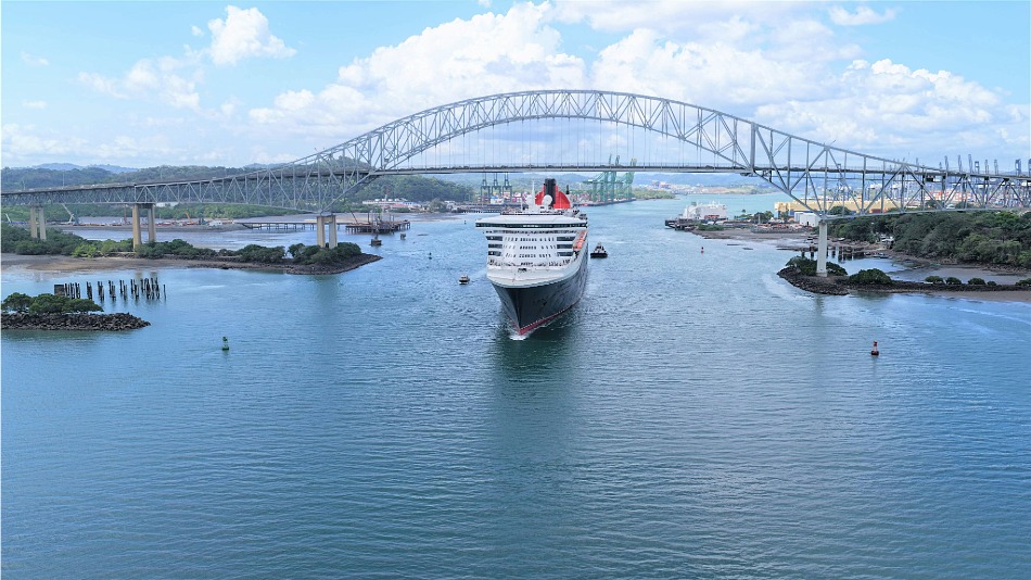 Cunard’s Queen Mary passes under the Bridge of Americas after passing through the Panama Canal