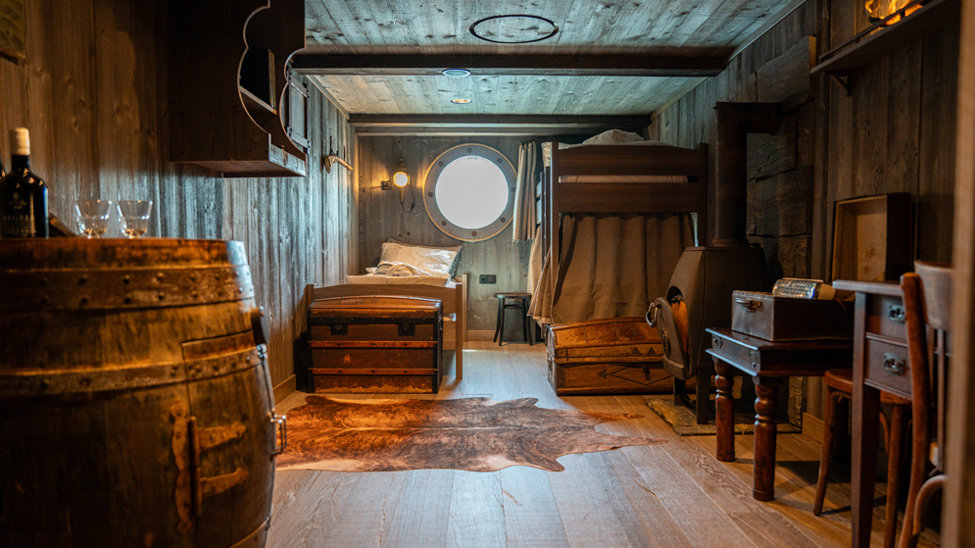 The HX Expeditions 1896 Heritage Cabin is rooted in late 19th-century expedition design