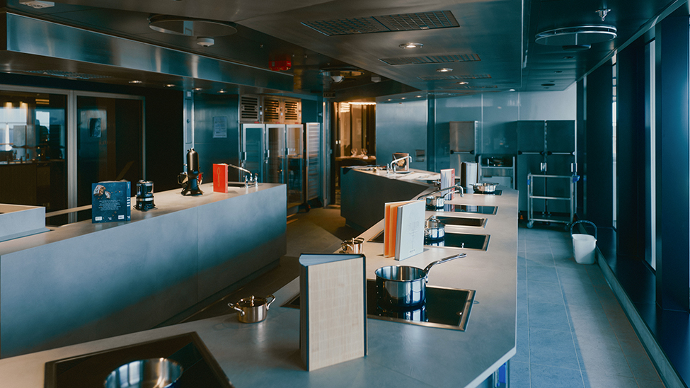 The Chef’s Kitchen hosts interactive cooking classes for small groups of guests (Photo: Explora Journeys)